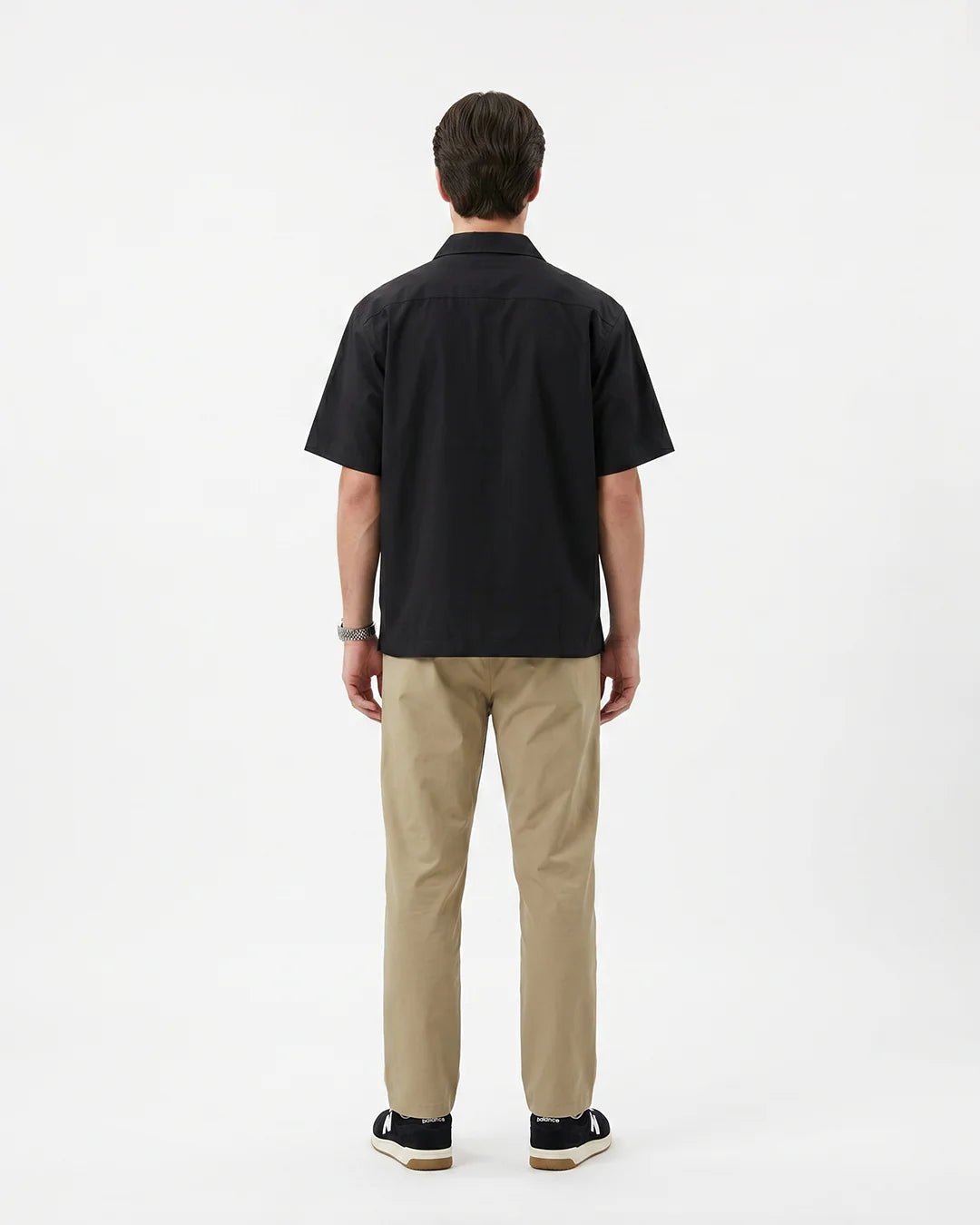 Men's short-sleeve dark linen button-up shirt, back view