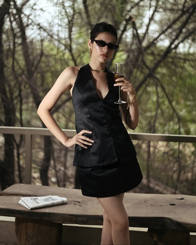 Black halter satin mini dress with sleeveless halter straps and V neckline