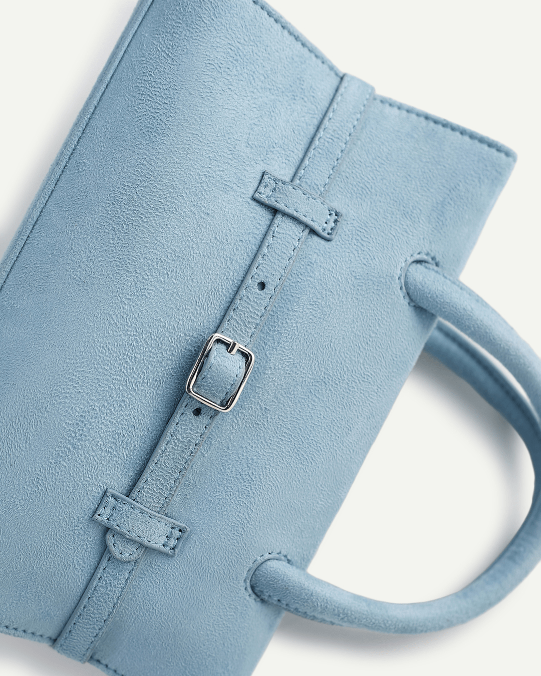 Powder blue mini handbag strap closure with rectangular buckle and ring