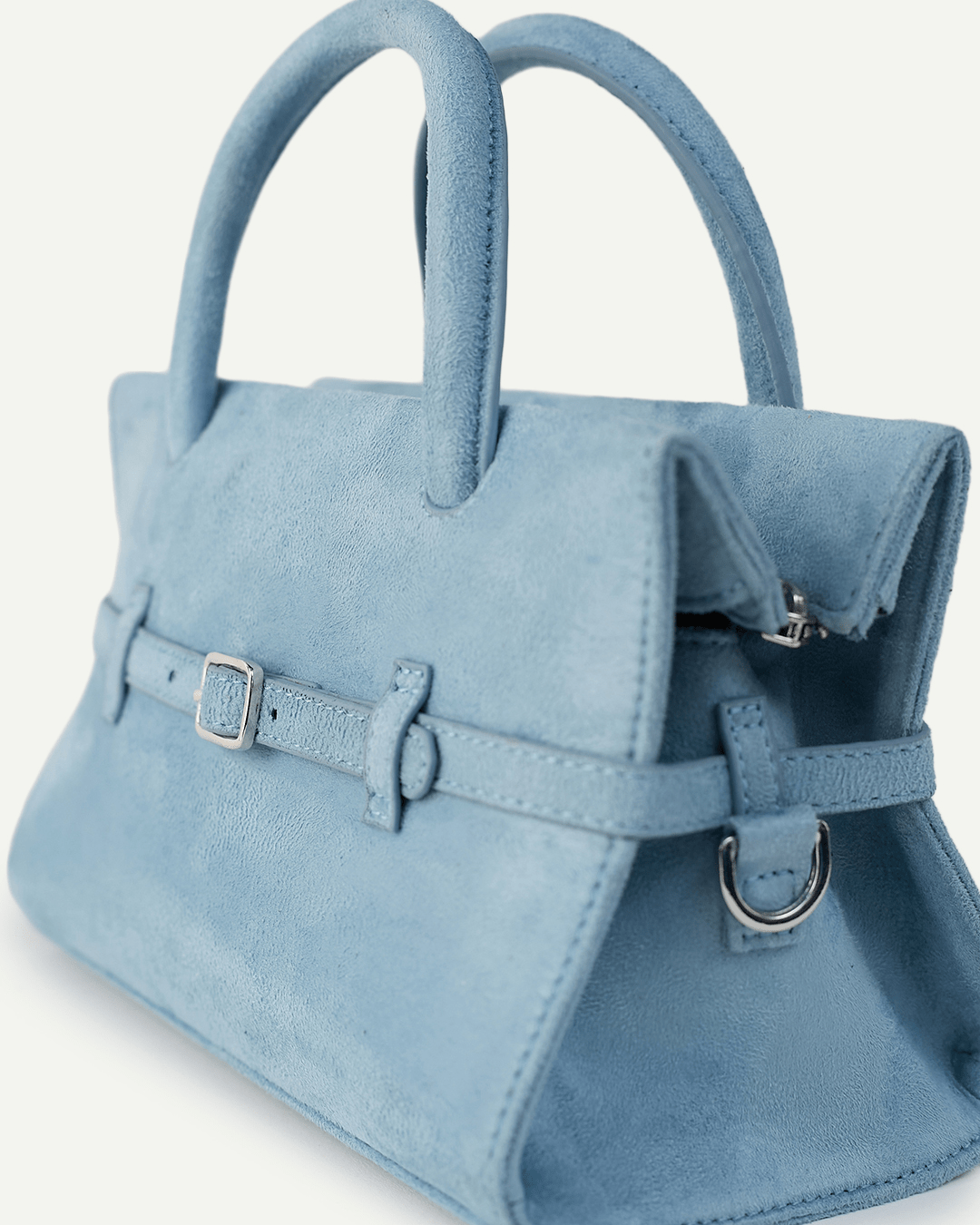 Powder blue mini handbag with shoulder strap, top handles, and metal rings