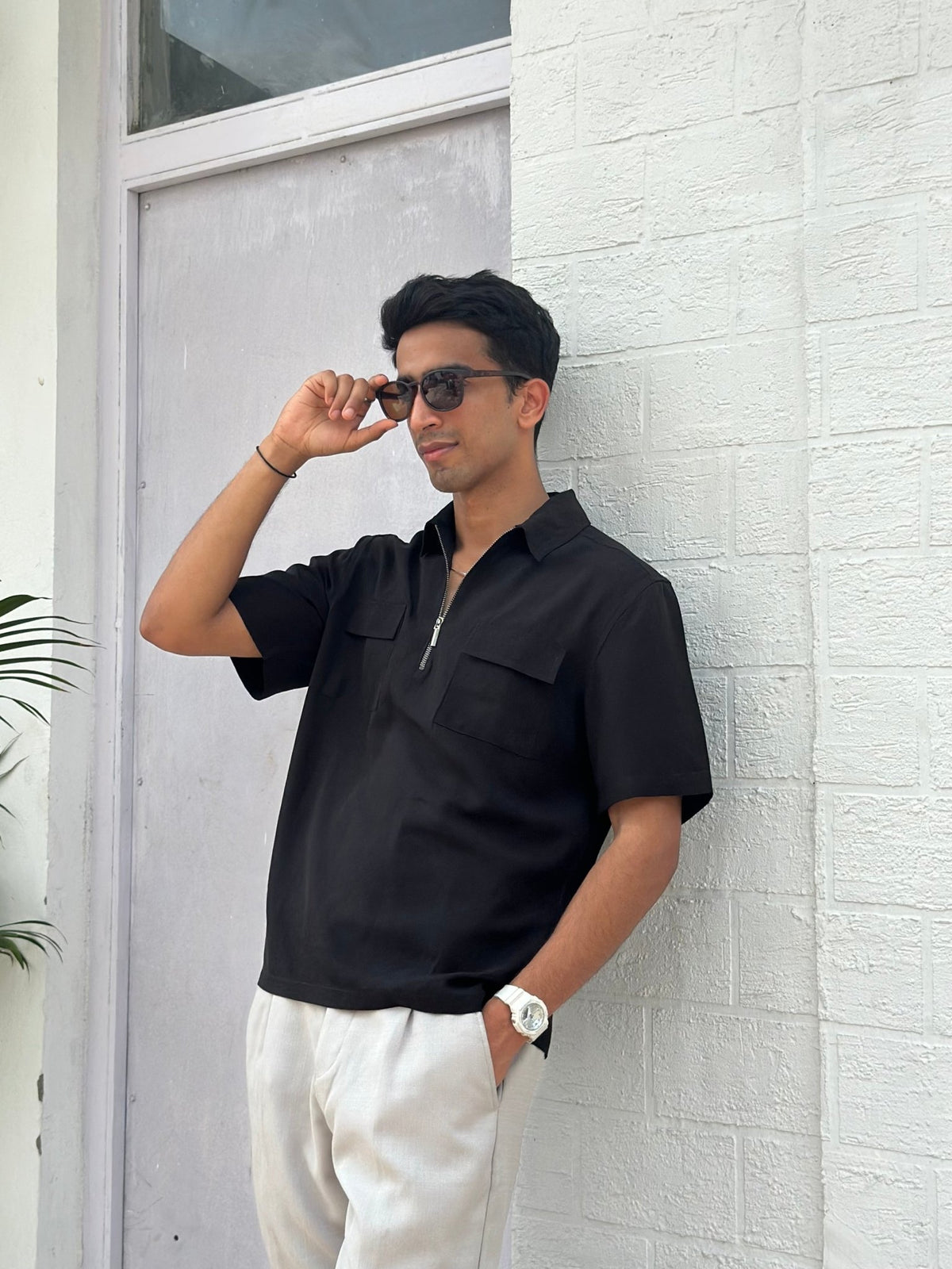 Men's black short-sleeve zip shirt with chest pockets, relaxed fit