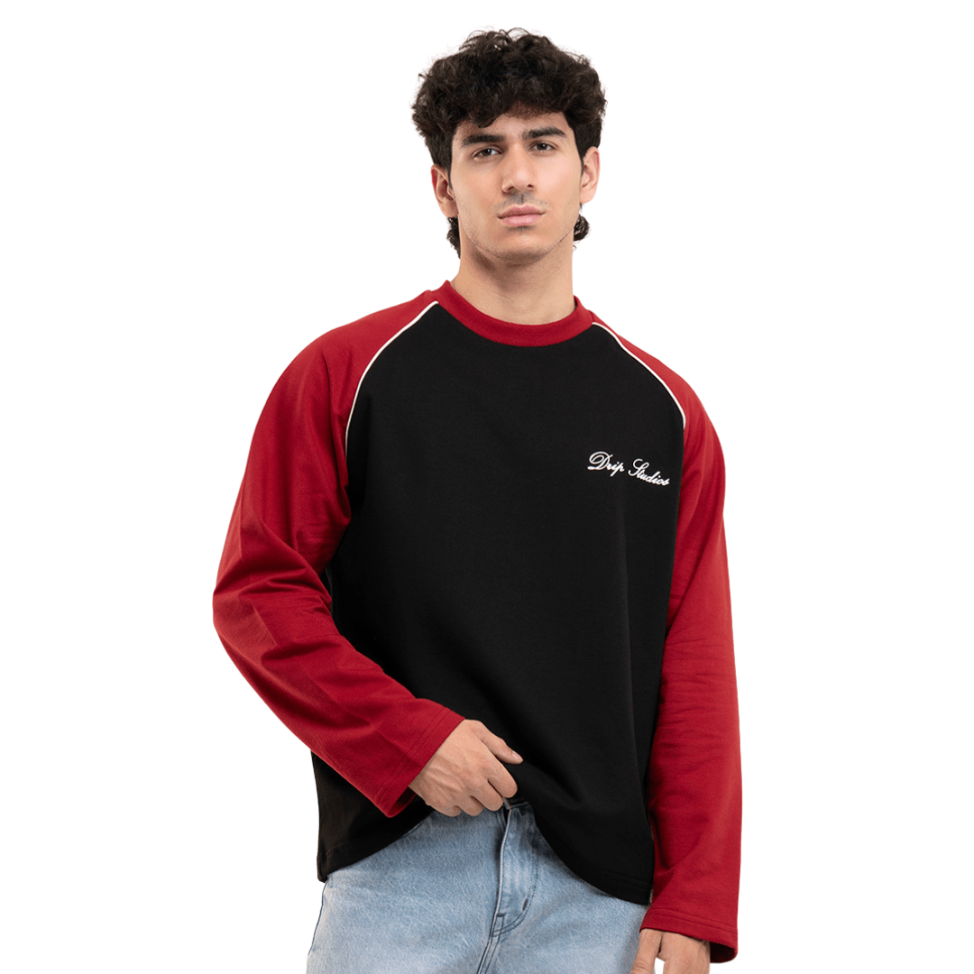 Men's black raglan baseball T-shirt with red sleeves and small white chest logo