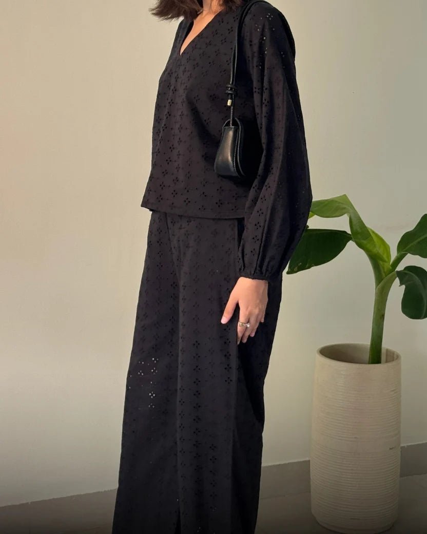Women's black broderie V-neck blouse with puff sleeves and wide-leg pants