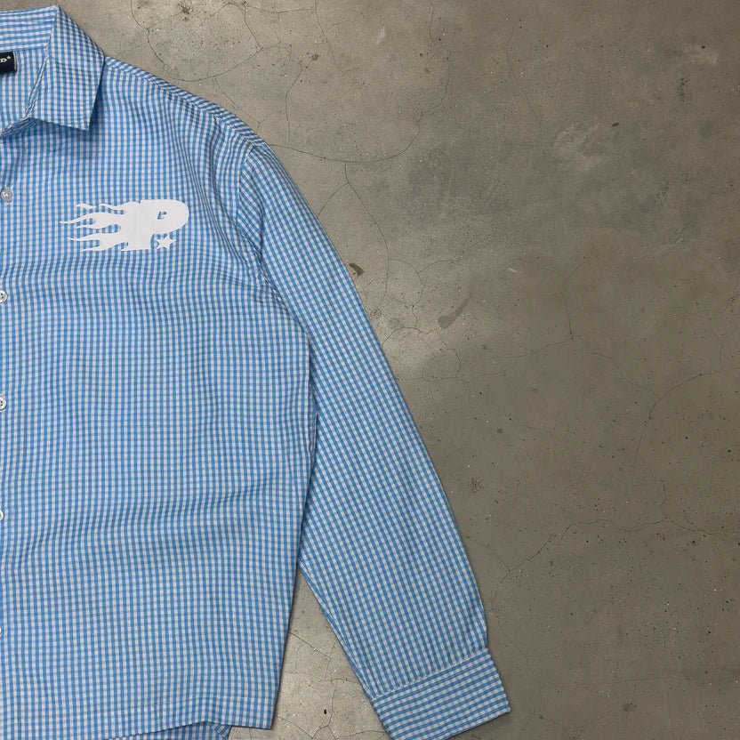 Blue check button-up shirt sleeve and chest logo detail