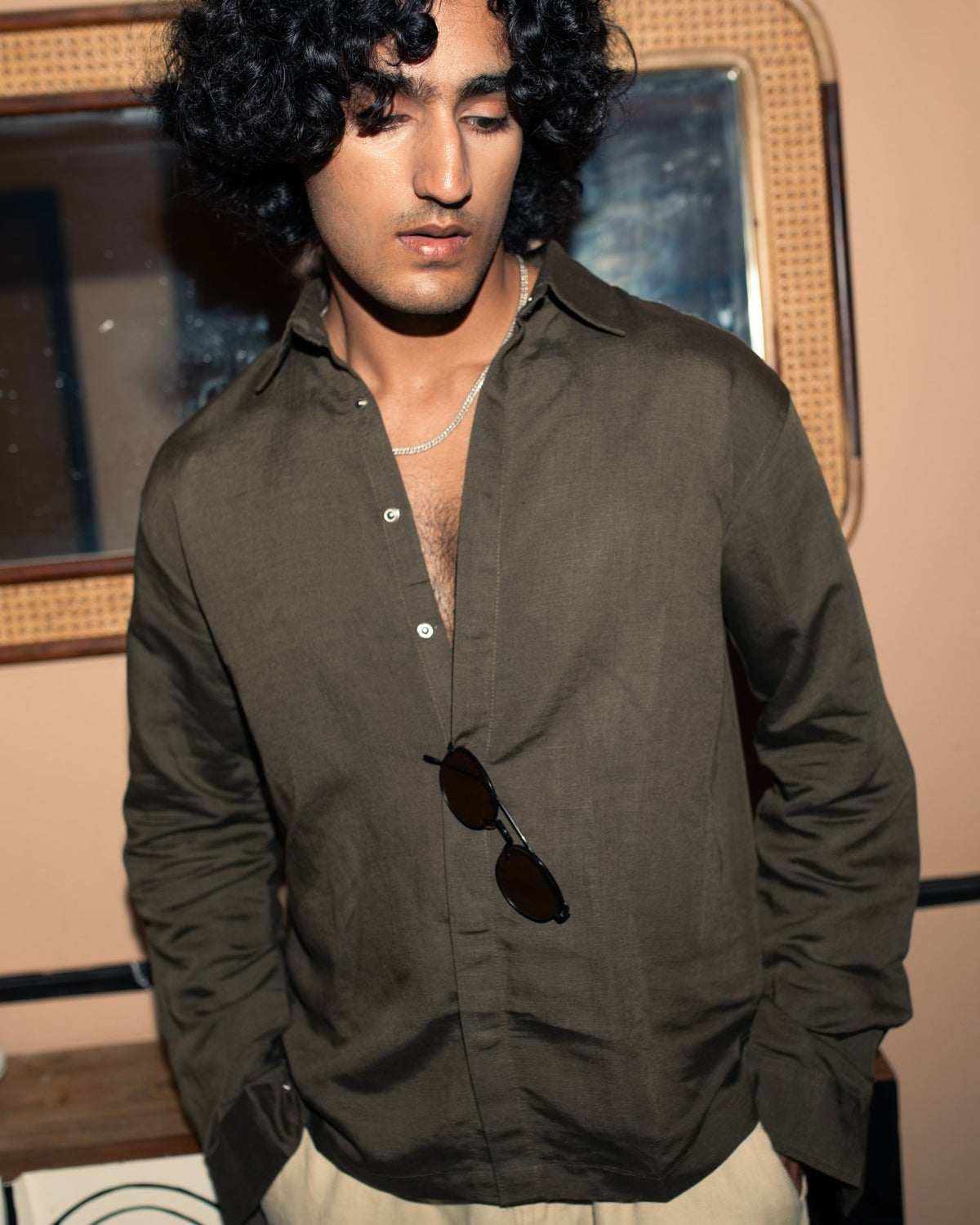 Olive snap-button shacket shirt with stand collar and long sleeves, front view