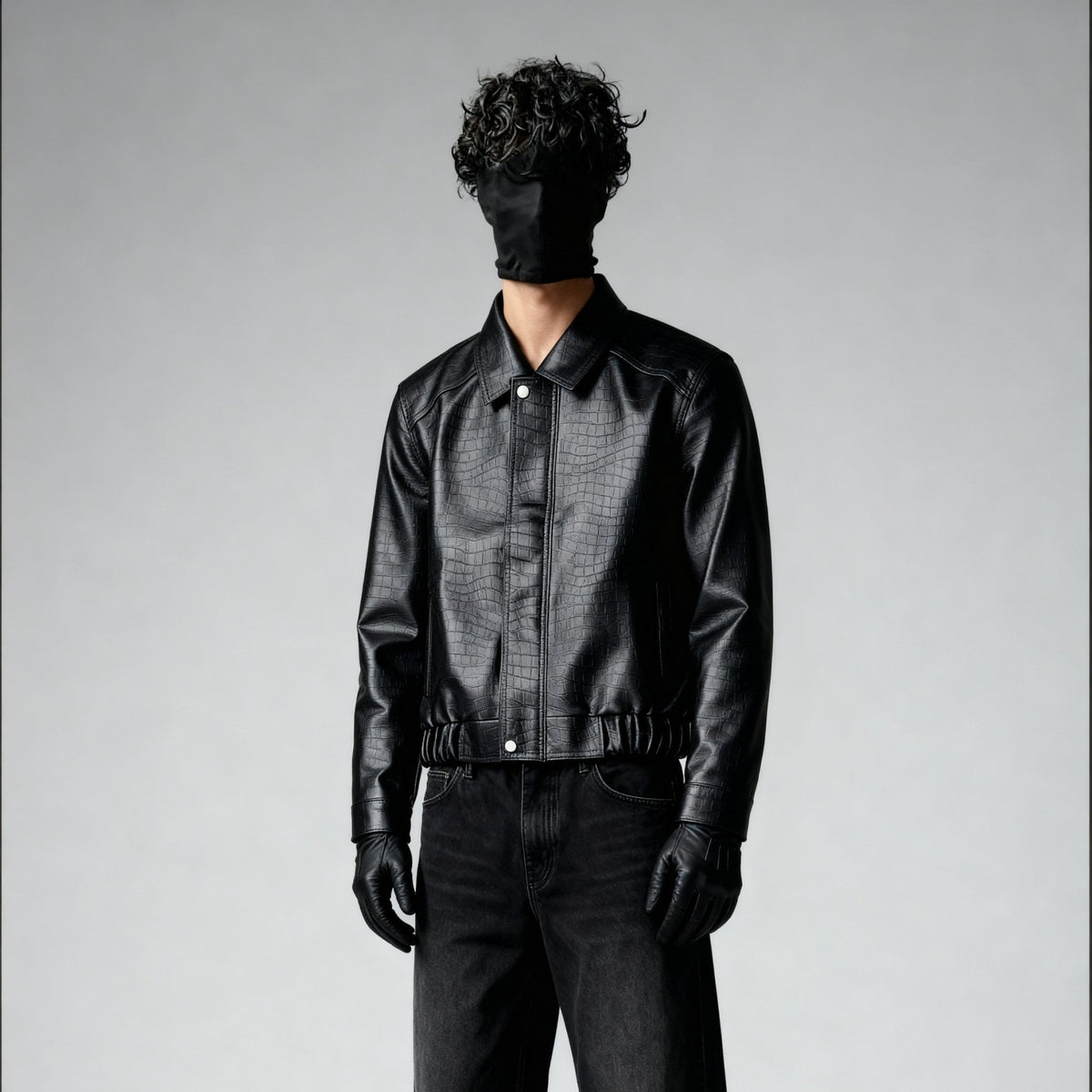 Black croc-textured leather bomber jacket with snap-front and spread collar, side/back view