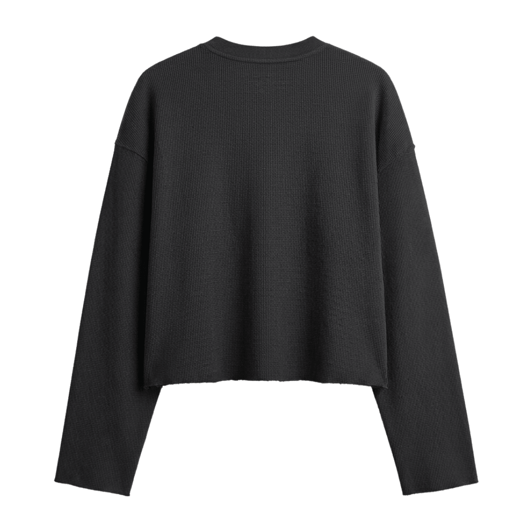 Black waffle-knit long-sleeve crewneck cropped top, relaxed fit.