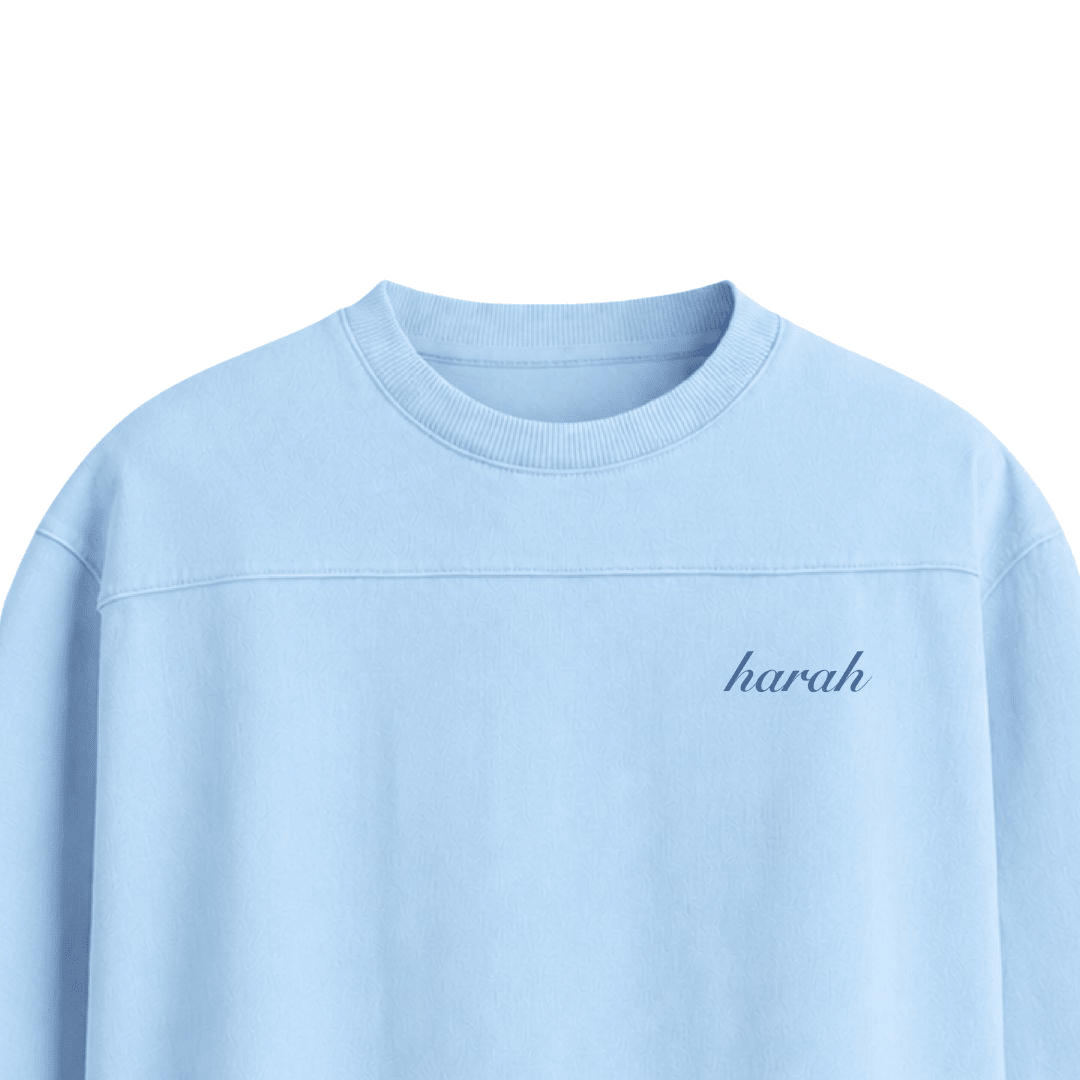 Light blue boxy T-shirt with 'harah' cursive logo on chest