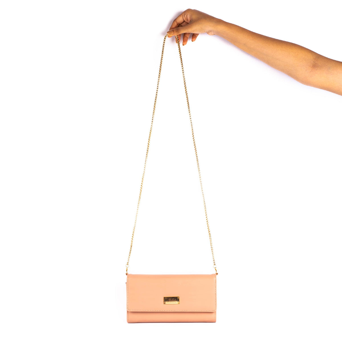 Peach clutch wallet with gold chain strap and front flap clasp