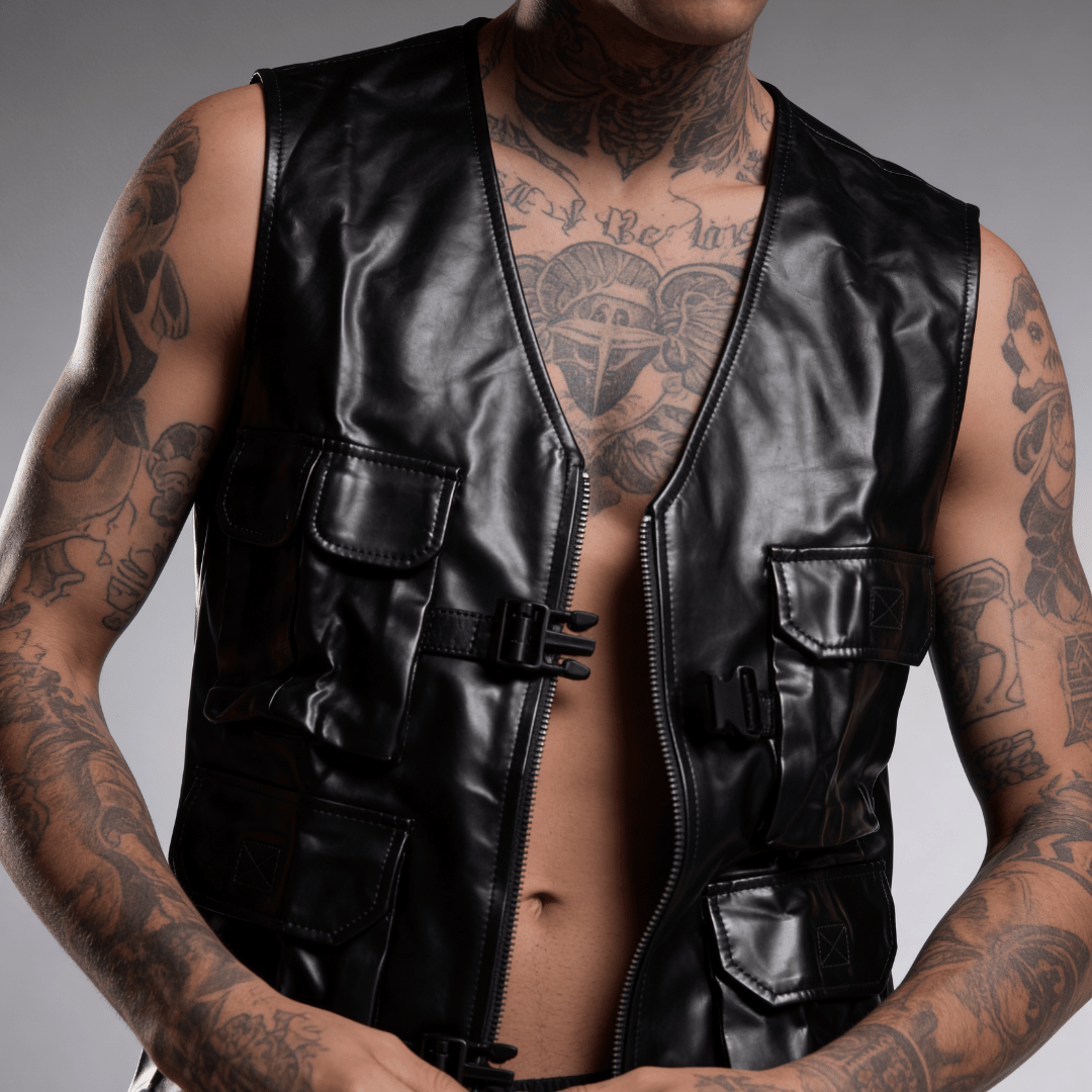 Black leather utility vest with zip front, flap pockets, and adjustable belt straps