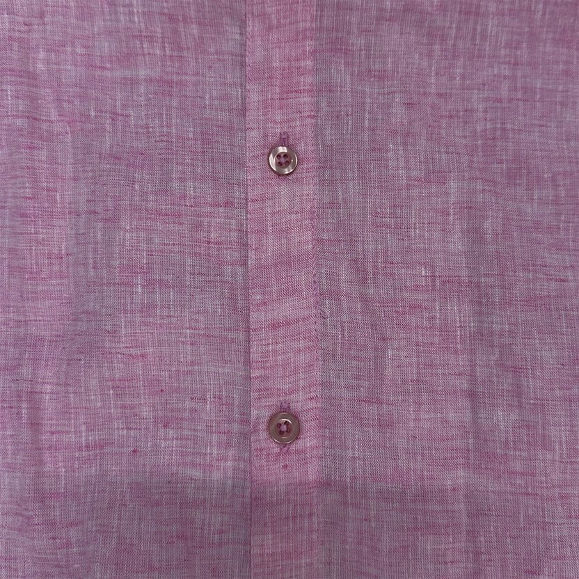 Pink button-up shirt close-up: front button placket with round buttons