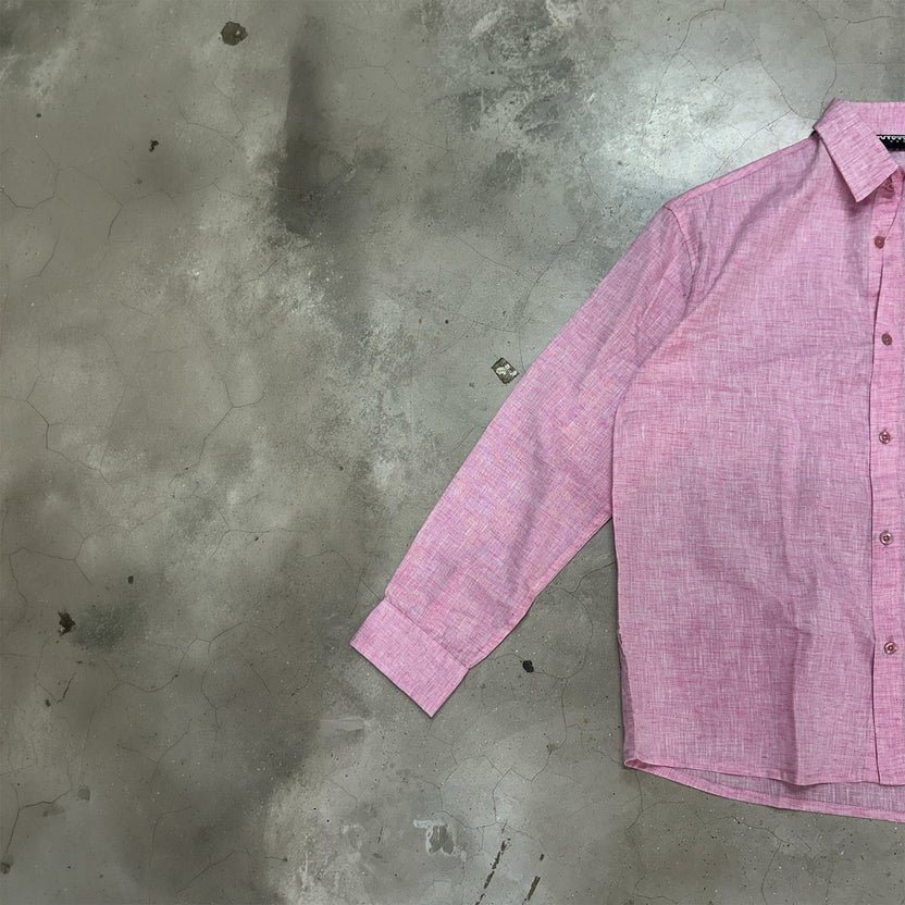 Pink long-sleeve button-up shirt with pointed collar, front angle