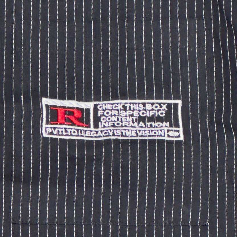 Navy pinstripe linen shirt close-up of brand tag