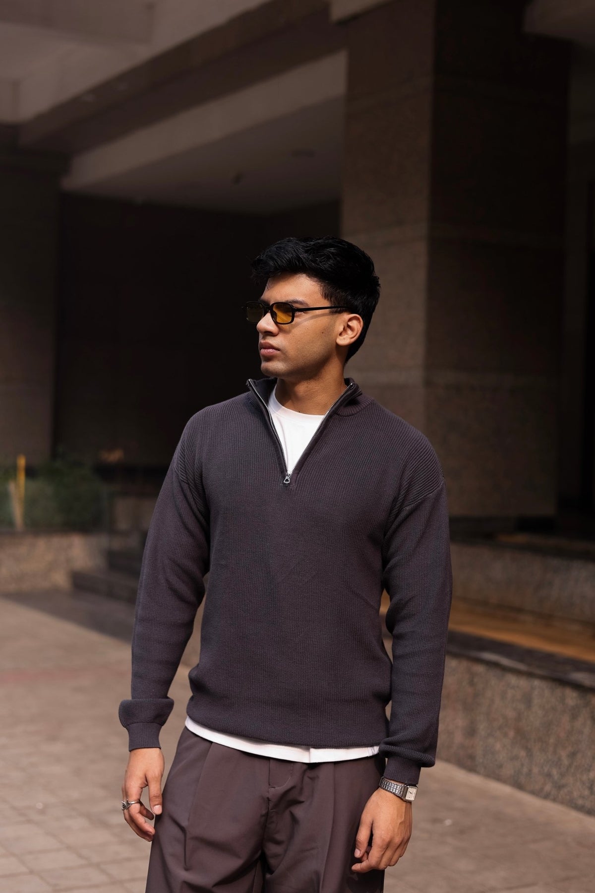 Charcoal quarter-zip knit sweater with half-zip placket and ribbed cuffs and hem.