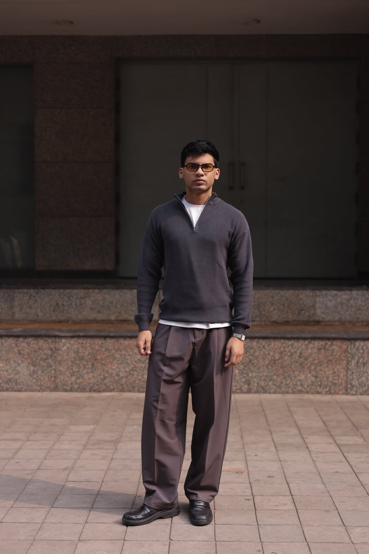 Charcoal quarter-zip knit sweater, half-zip front, ribbed cuffs and hem.