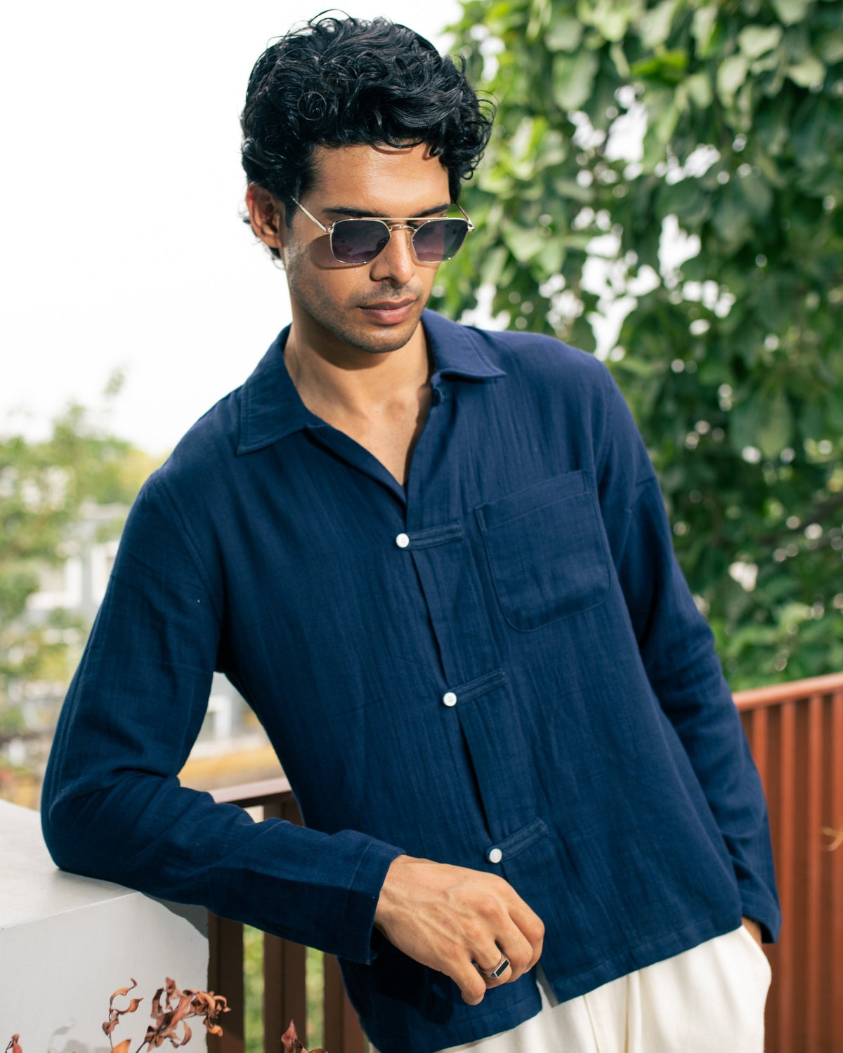 Navy long-sleeve button-up shirt with chest pocket and button front