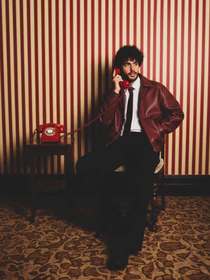Cherry red leather jacket with zip front and stand collar, 3/4 view