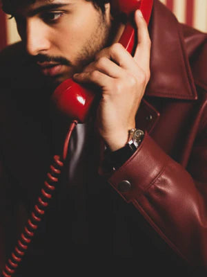 Cherry red leather jacket sleeve and shoulder detail with zip and snap collar