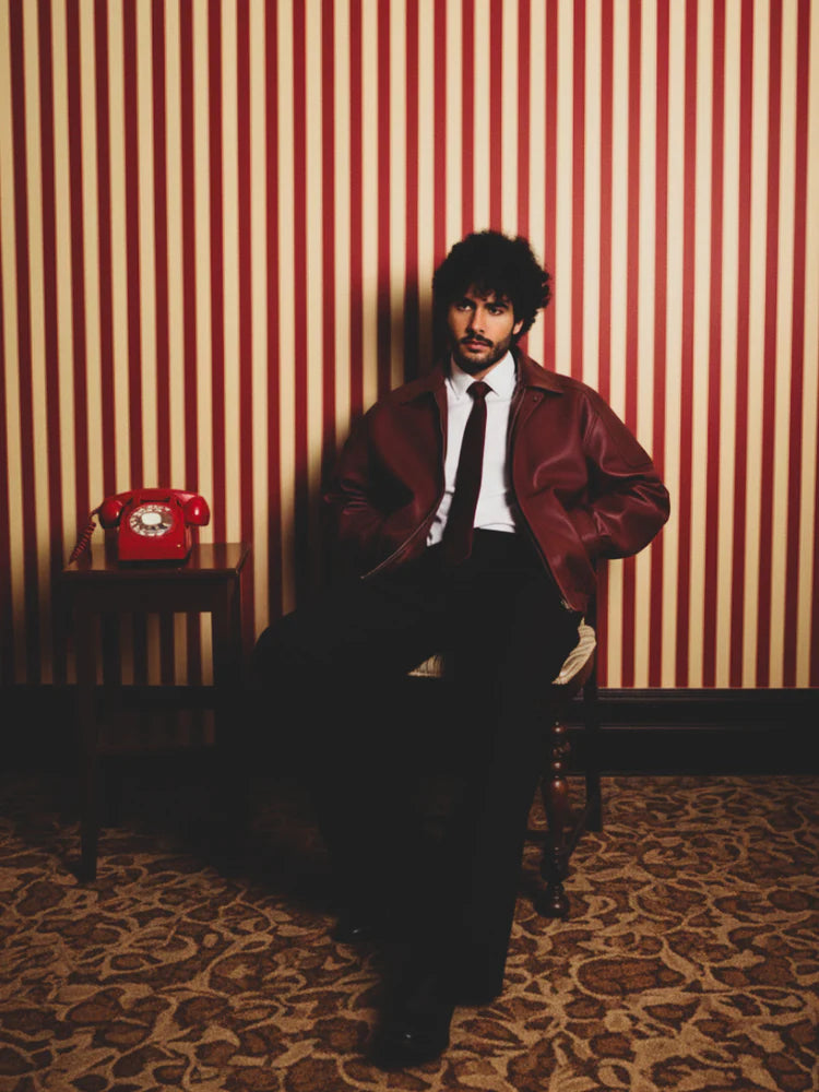 Cherry red leather jacket with zip front, stand collar, ribbed cuffs and hem
