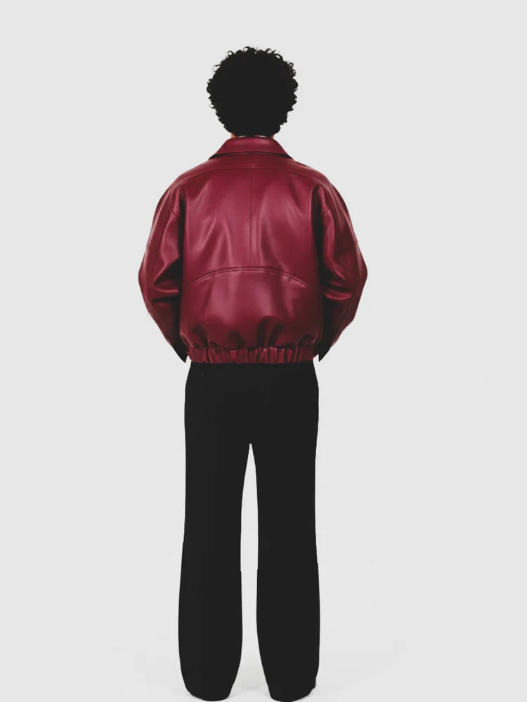 Cherry red leather jacket, back view with zip-up style and ribbed cuffs