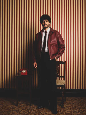 Cherry red leather jacket with zip front and stand collar, side 3/4 view