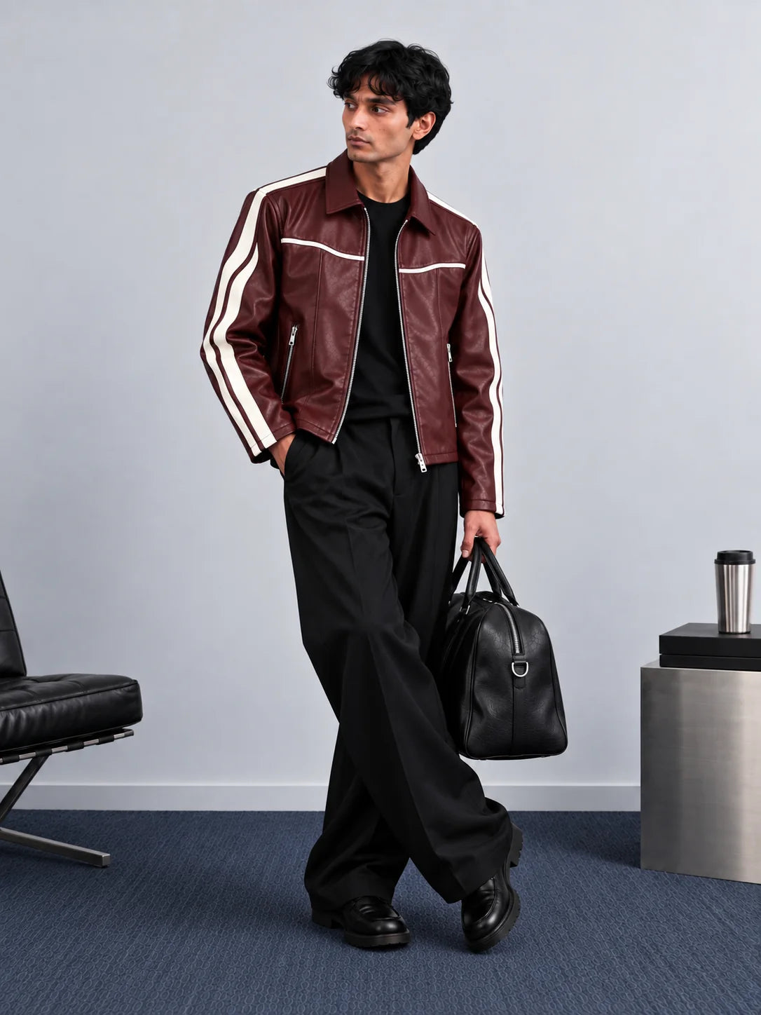 Burgundy leather jacket with white stripe details, worn with black trousers