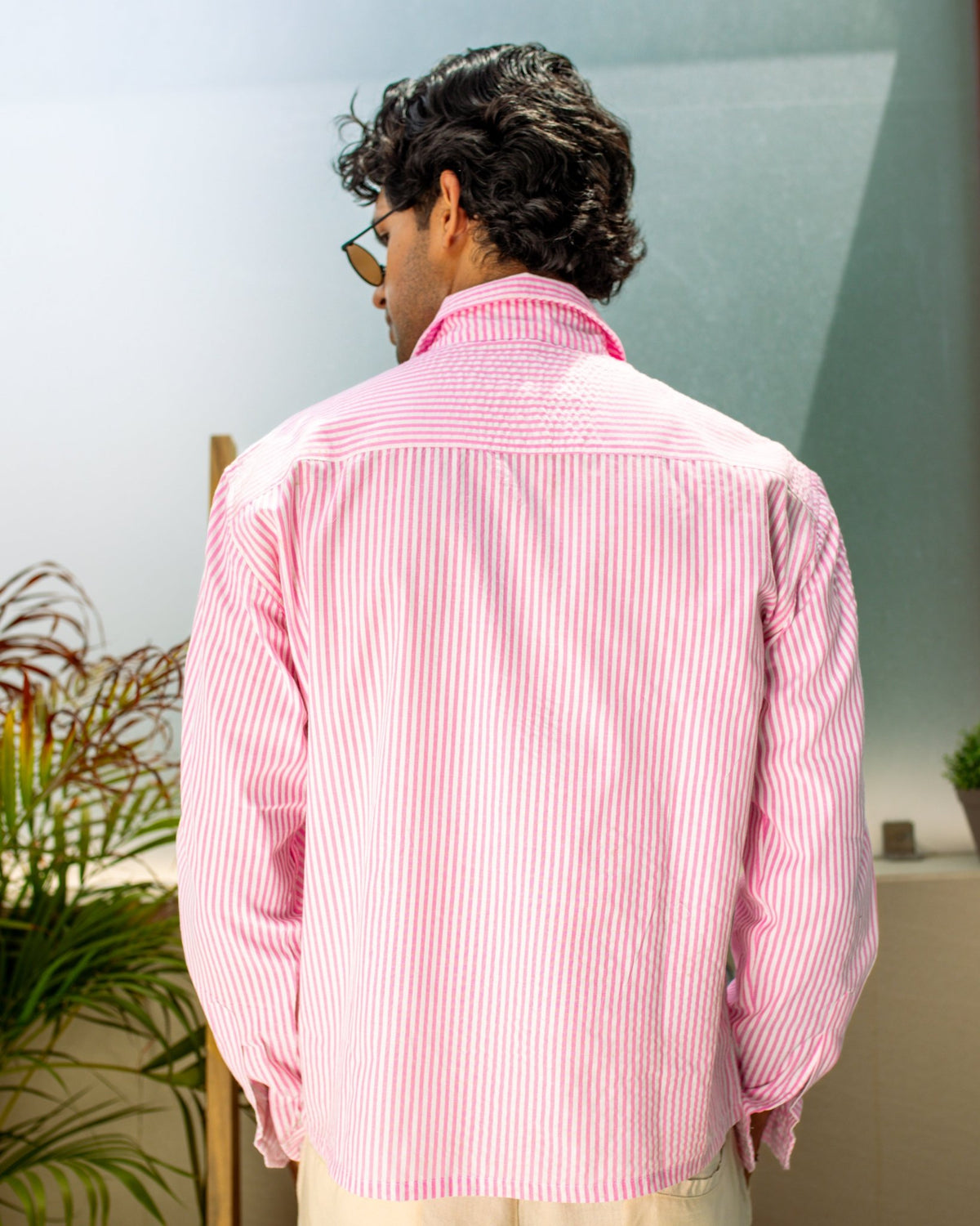 Pink striped seersucker button-up shirt, back view
