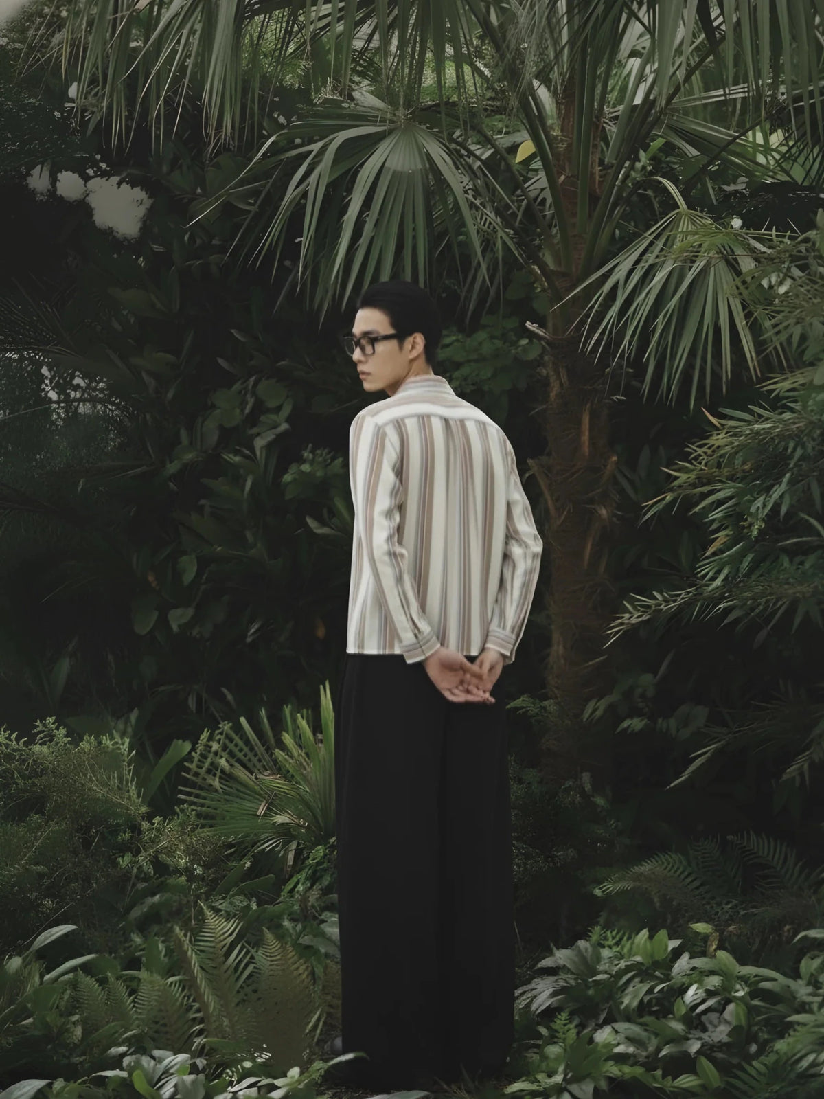 Back view cream striped boxy shirt with vertical tan and blue lines, button-front