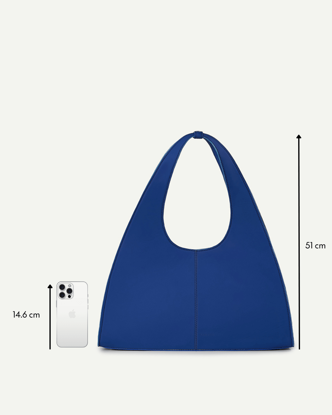 Blue triangular tote bag with oval cutout handle and short top loop.