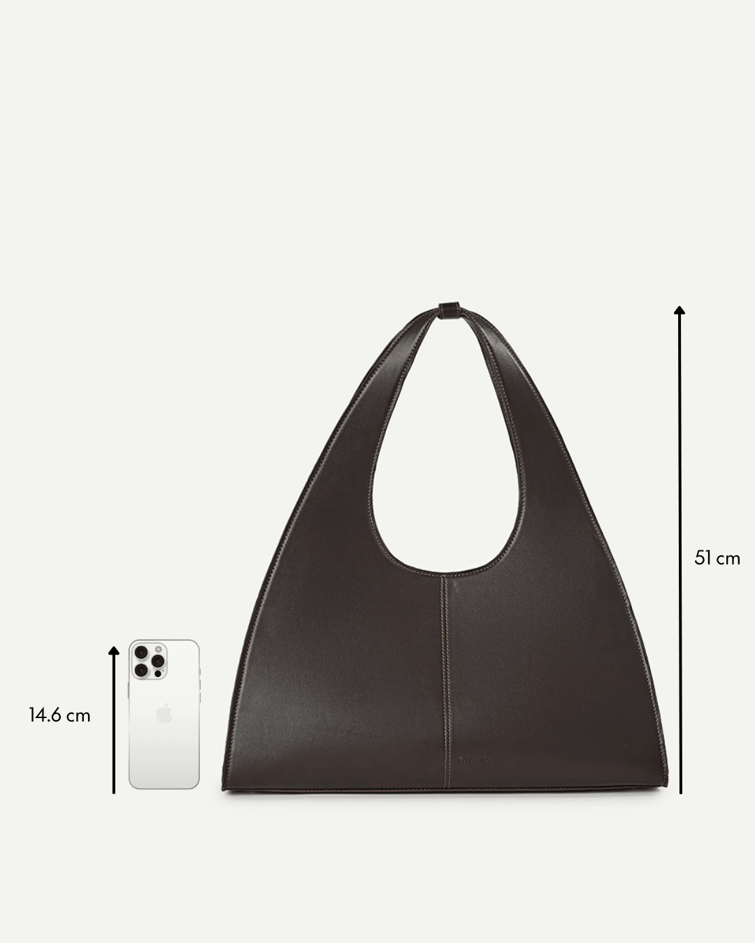Dark brown leather-look triangular tote bag with oval cutout front and top handle