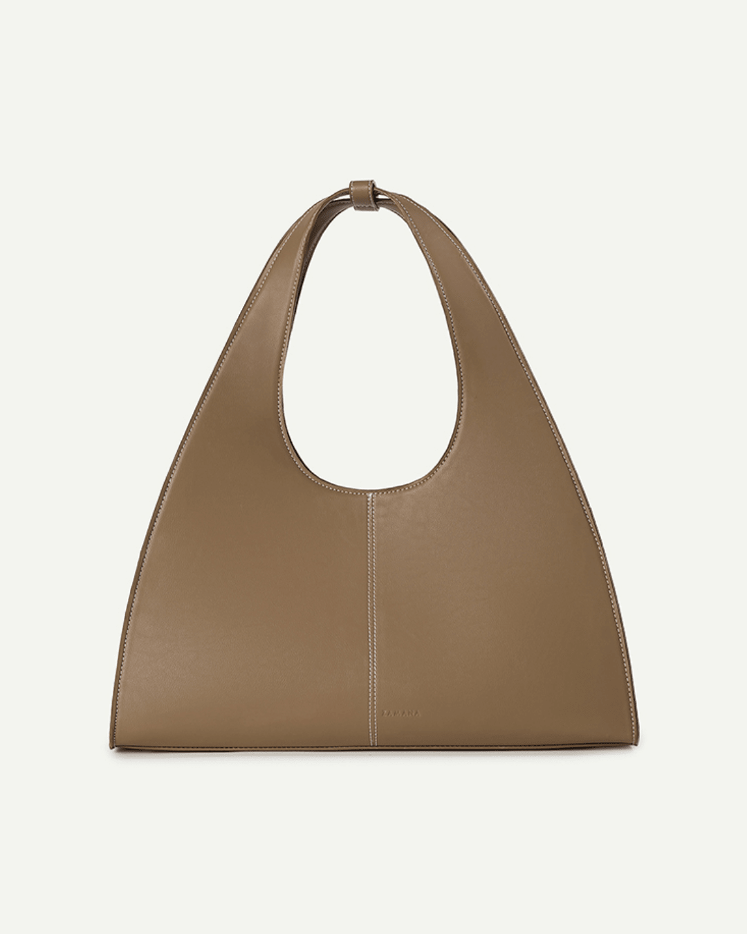 Caramel brown triangular handbag with short top handle and oval cutout opening