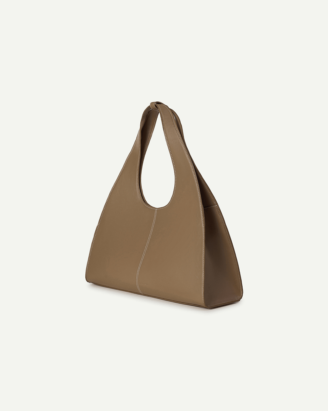 Caramel brown triangular handbag with short handle, angled side view