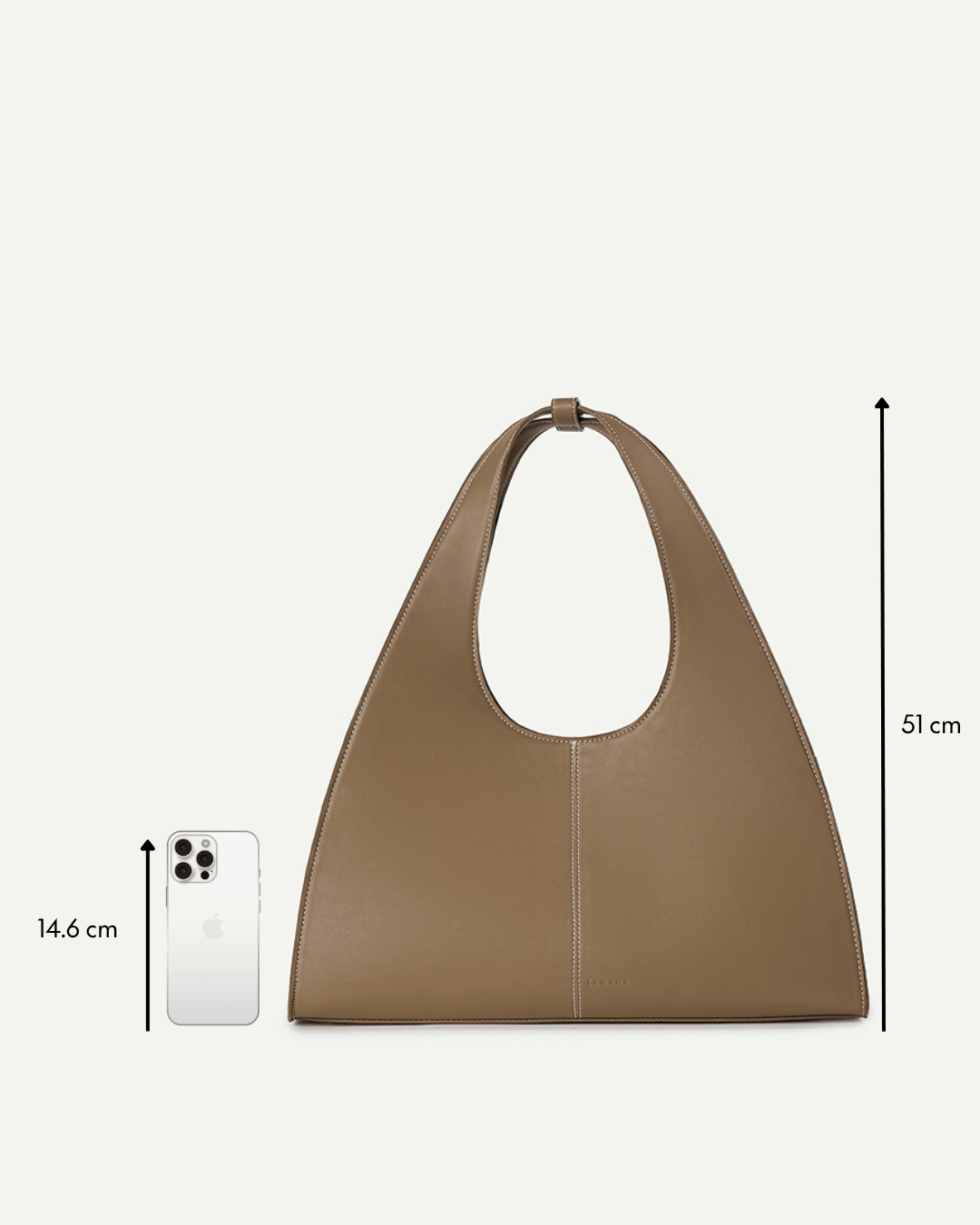 Caramel brown triangular handbag with short top handle and stitched center seam