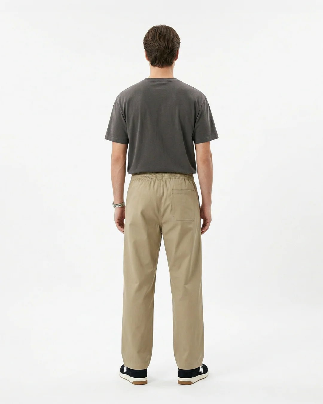 Beige Sand Motion sweatpants, back view, elastic waistband and relaxed straight legs