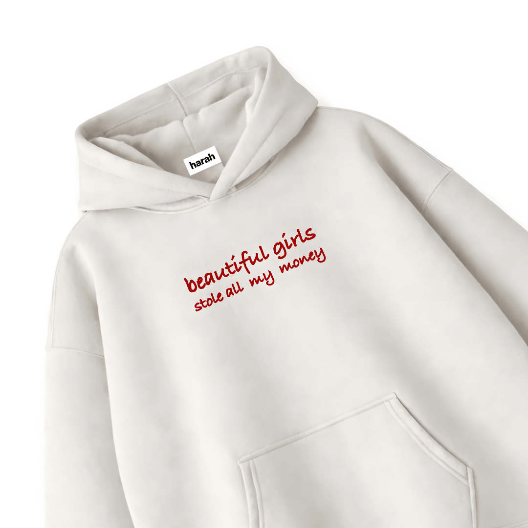 White hoodie front close-up with red script text and a kangaroo pocket