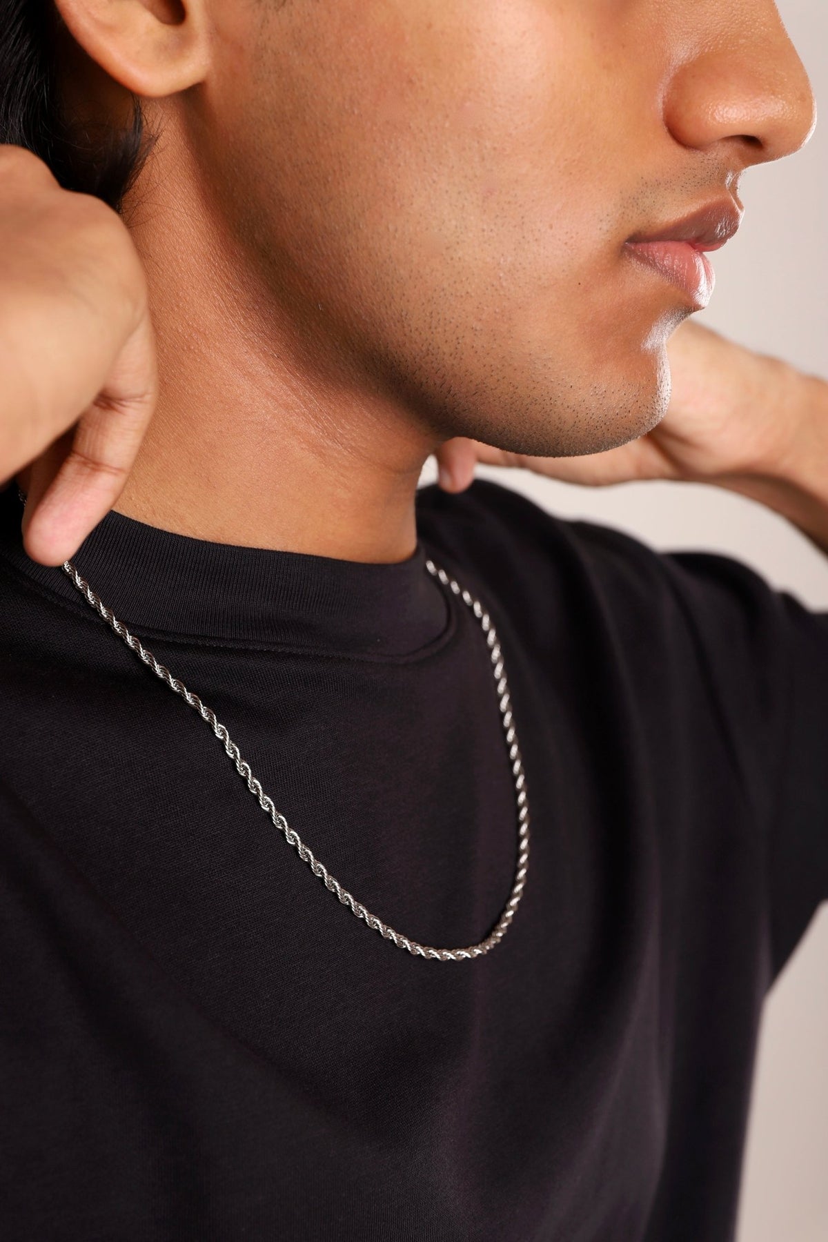 Slate rope chain necklace with twisted rope links, worn around the neck
