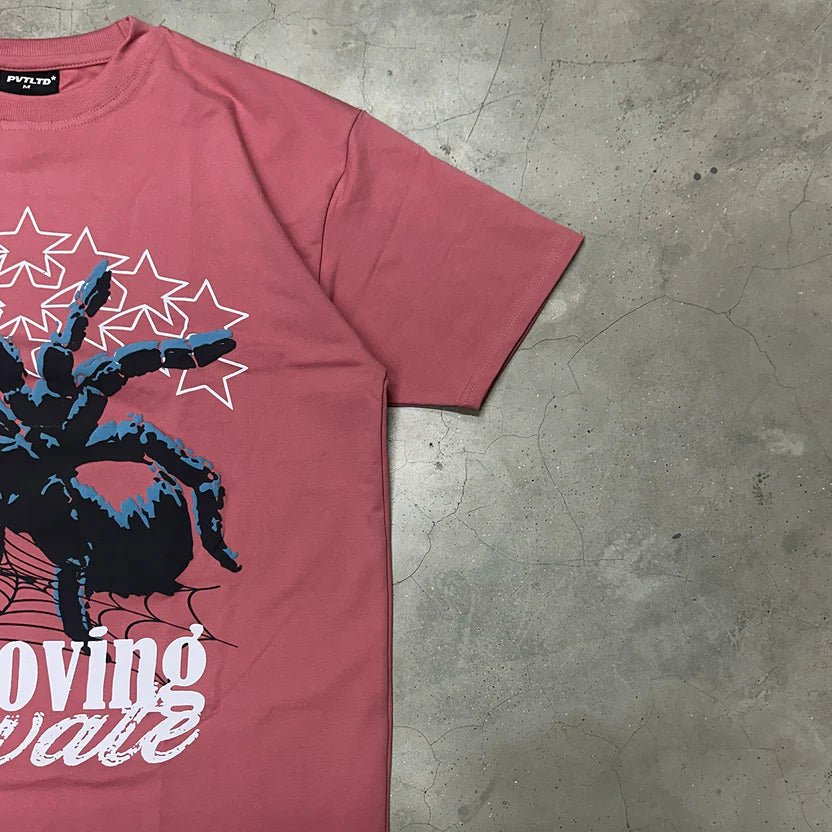 Maroon graphic T-shirt sleeve and chest portion with spider web and white text