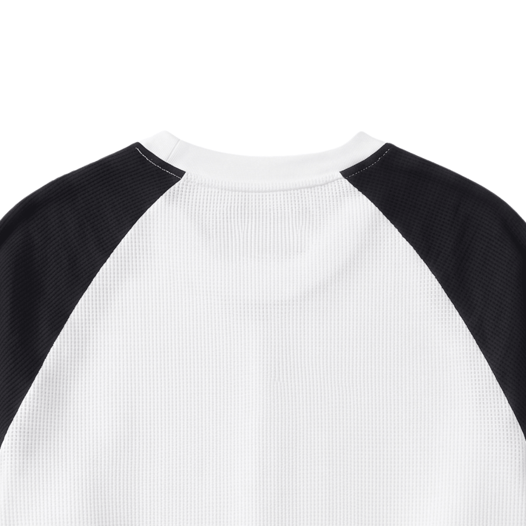 Black-and-white waffle knit raglan crewneck long-sleeve top