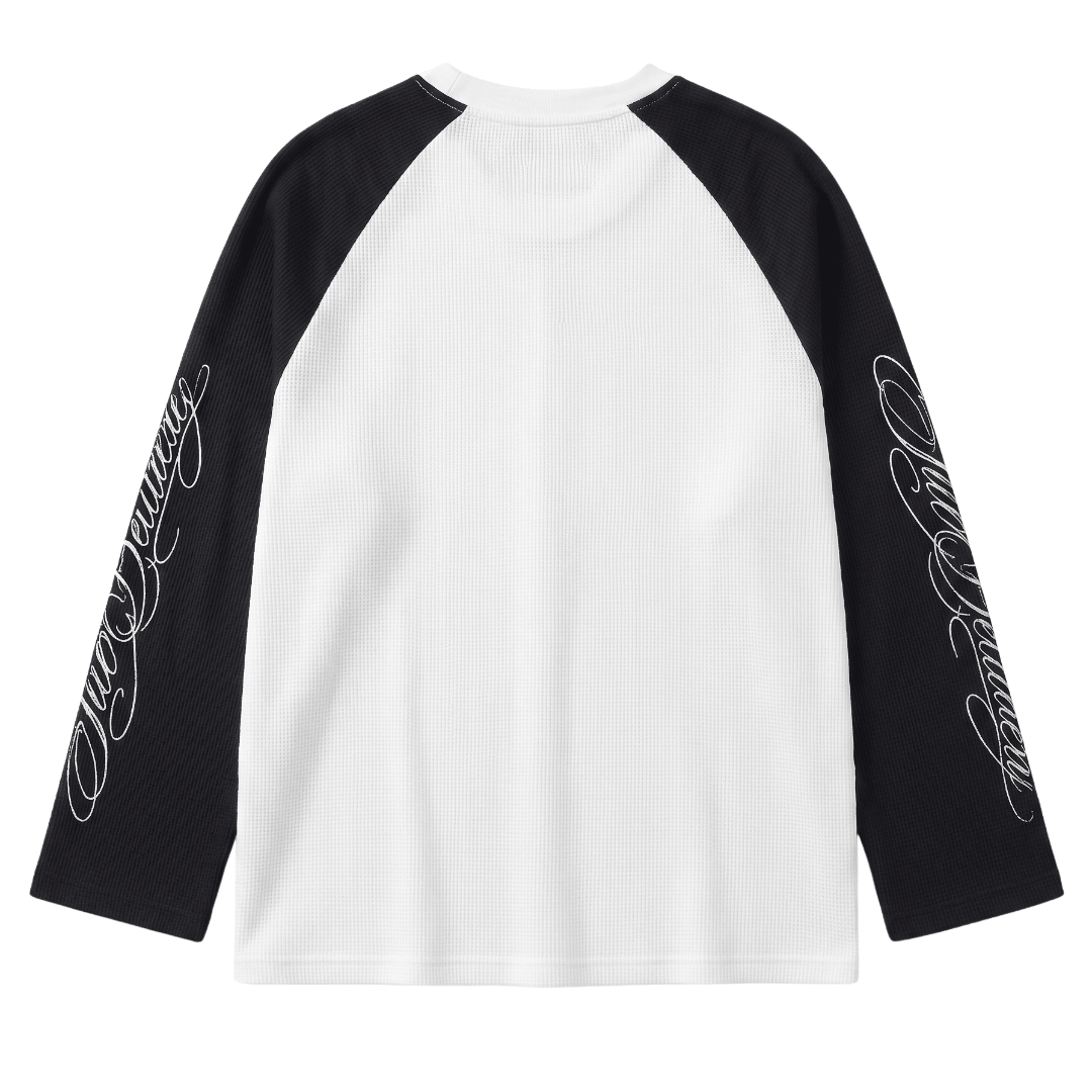 Black long-sleeve raglan top with white body and script sleeve print