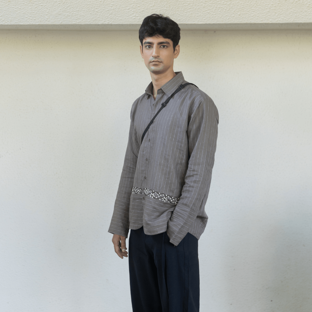 Gray pinstripe button-up shirt with embroidered waist trim; long sleeves