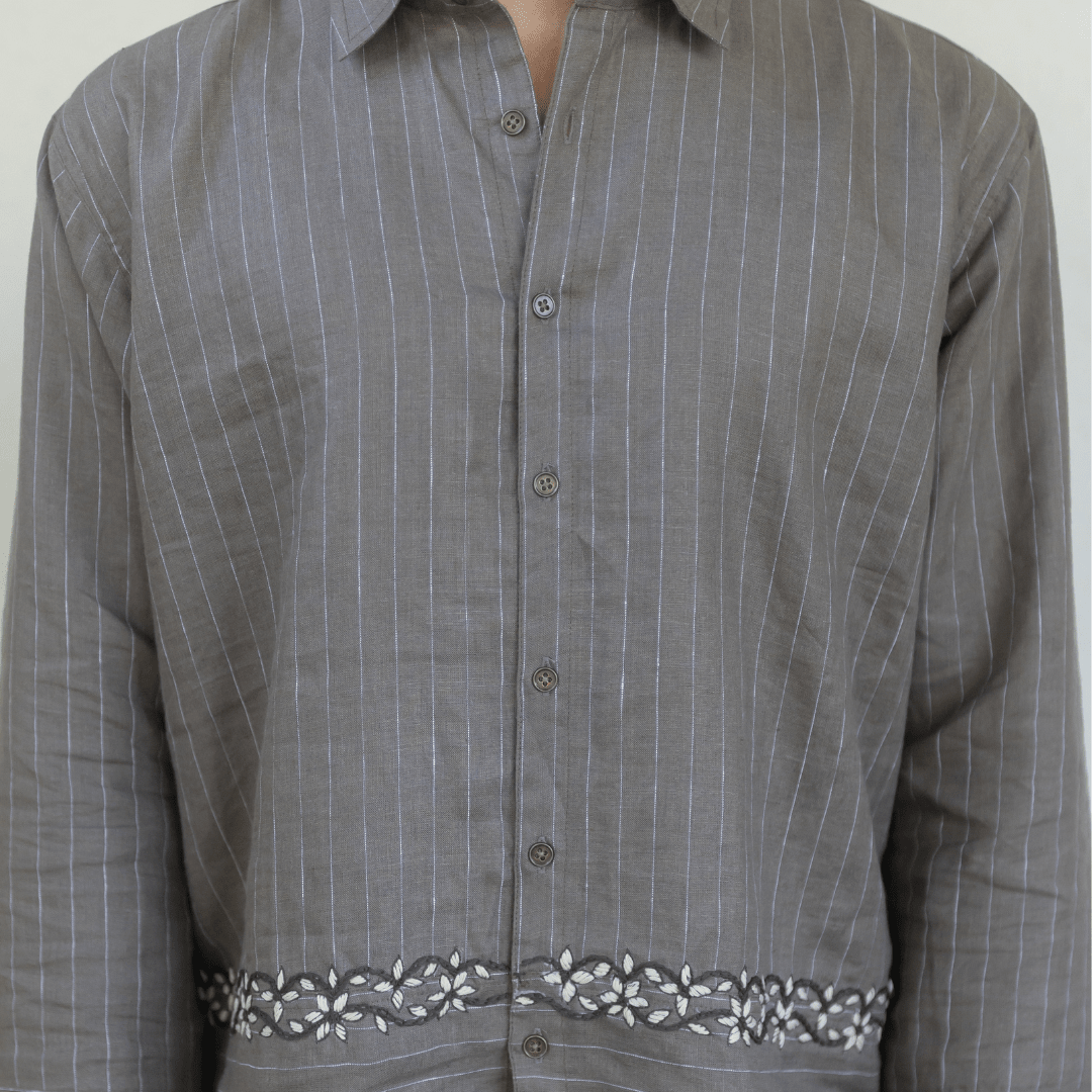 Gray pinstripe button-up shirt with embroidered waist trim and button placket