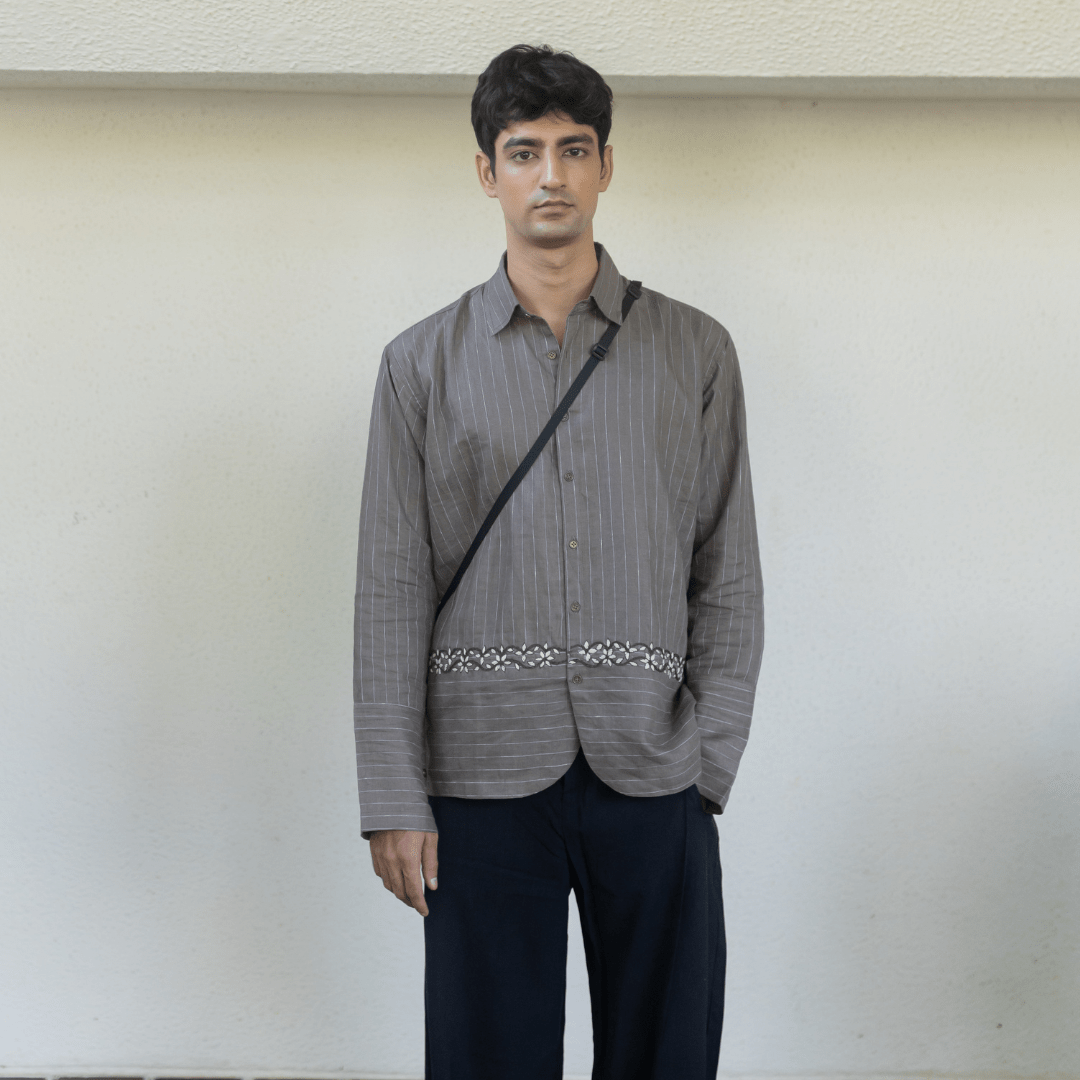 Gray pinstripe button-up shirt with embroidered waist trim and front buttons