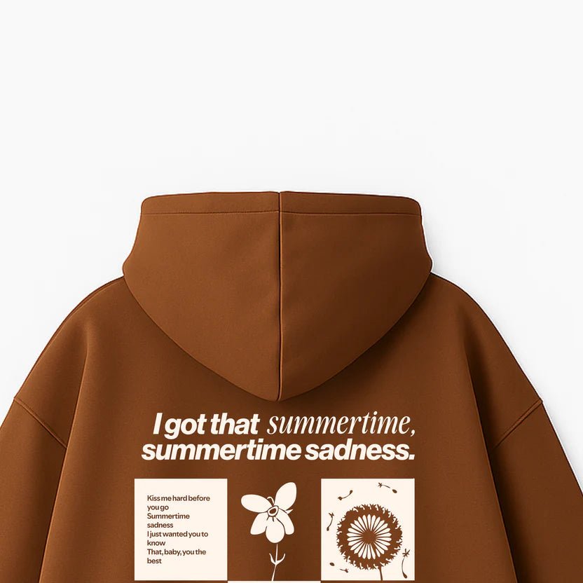 Brown hoodie back view with large graphic text and floral collage print under hood.