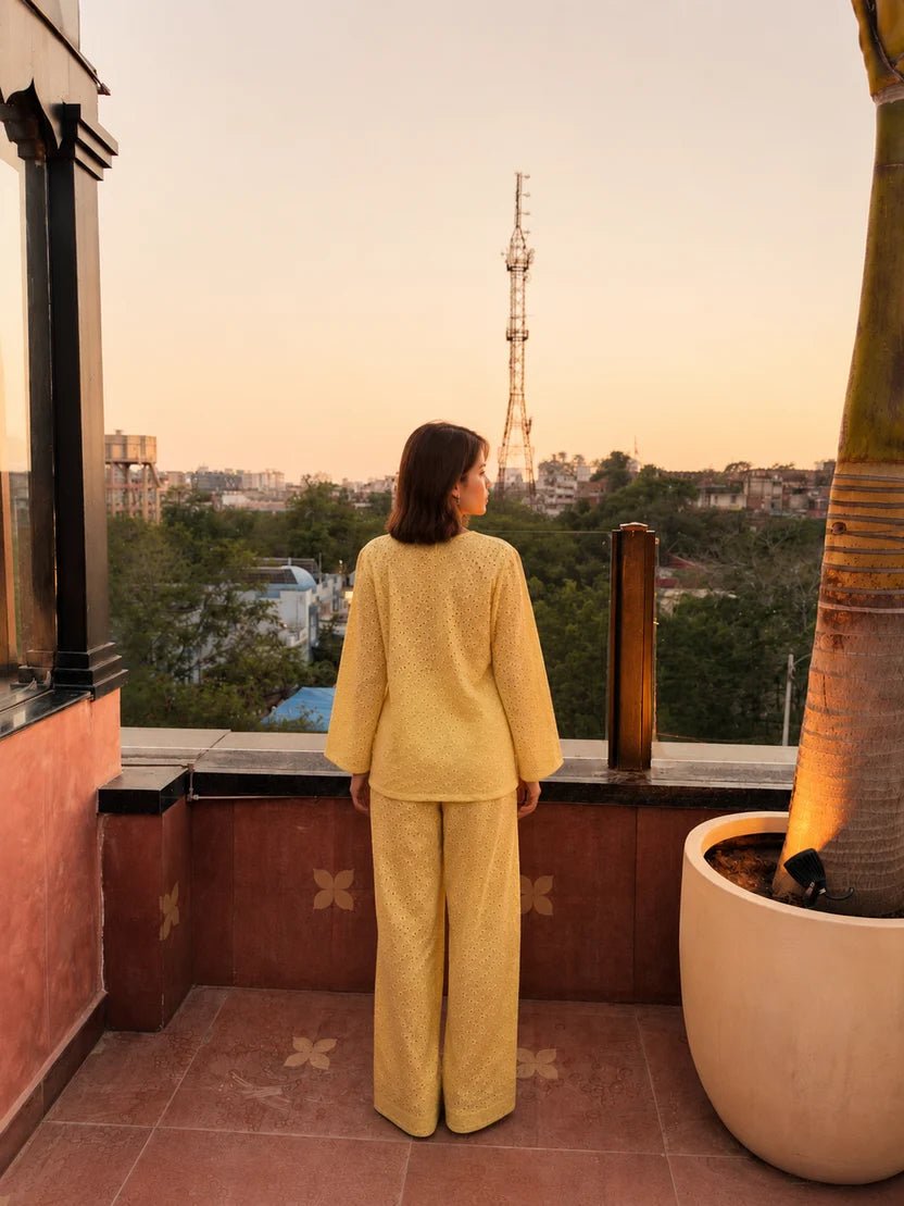 Women’s embroidered broderie co-ord set, back view: long-sleeve top and wide-leg pants