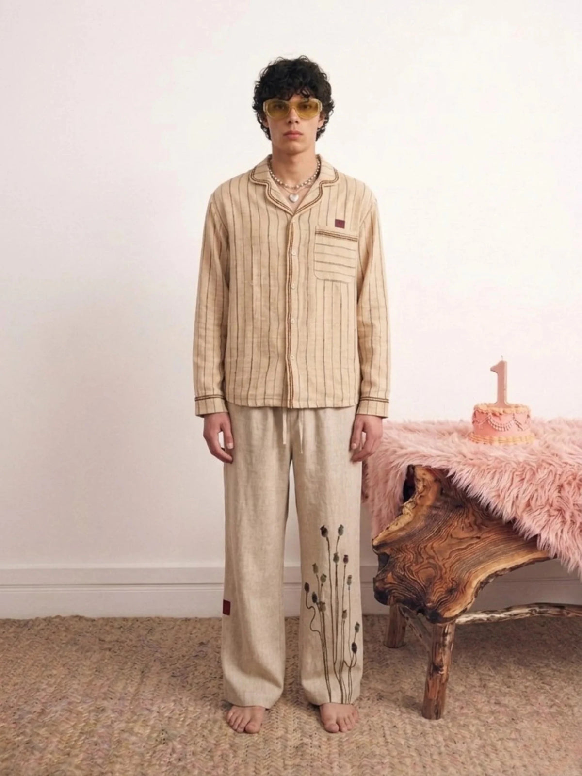 Beige vertical-striped linen button-up shirt with chest pocket and red logo
