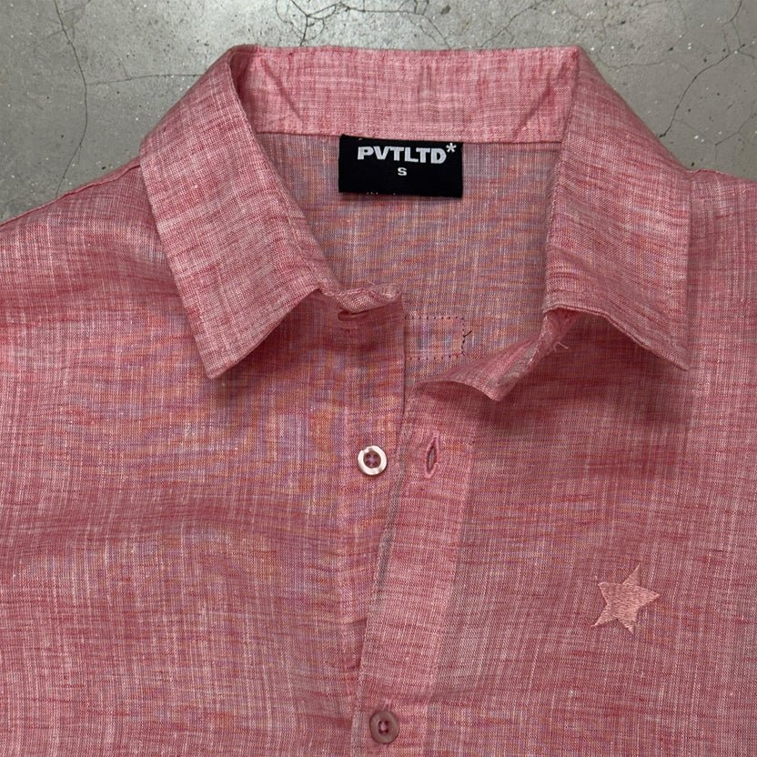Peach solid button-up shirt with pointed collar, front buttons, and small star detail