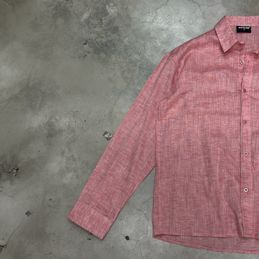 Peach button-up shirt with long sleeves and front button placket