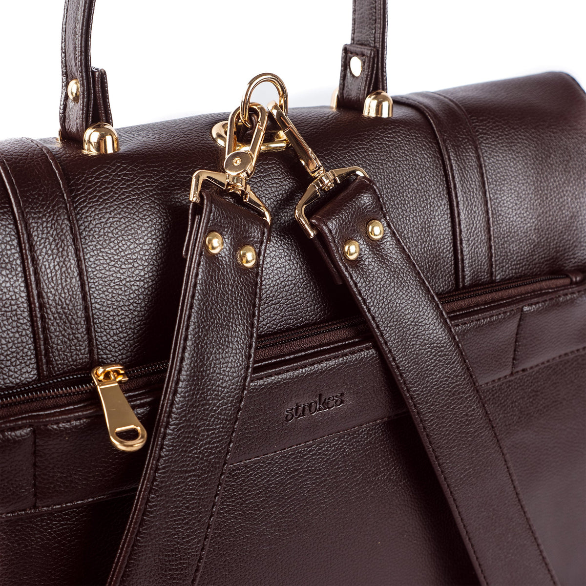 Mahogany leather-like bag with front flap buckle and gold hardware on textured grain