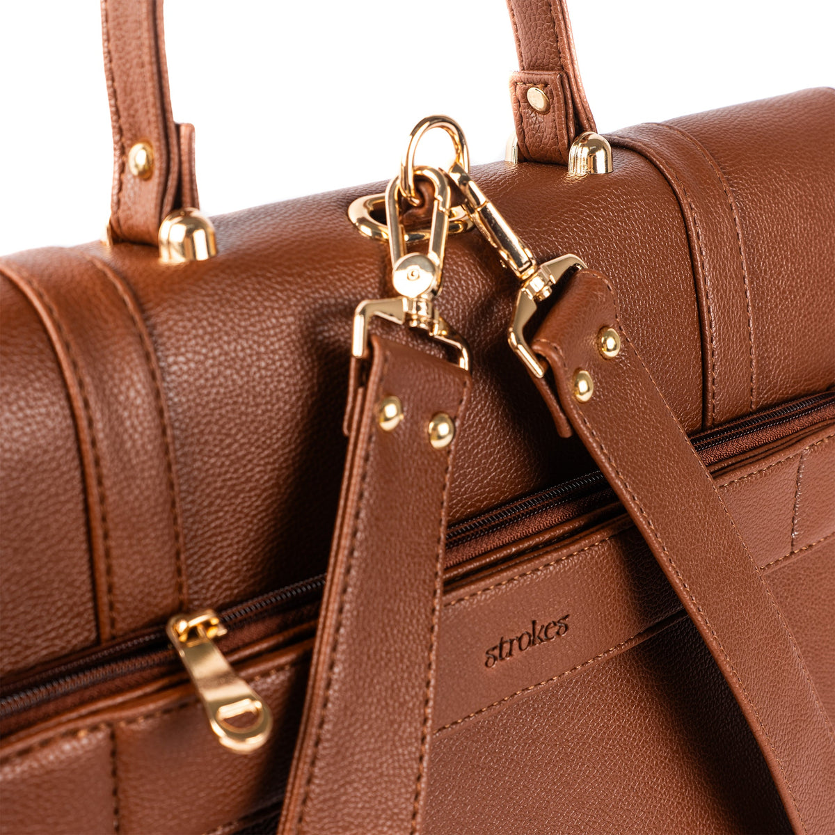 Mocha brown leather work bag close-up with front clasp and shoulder strap hardware
