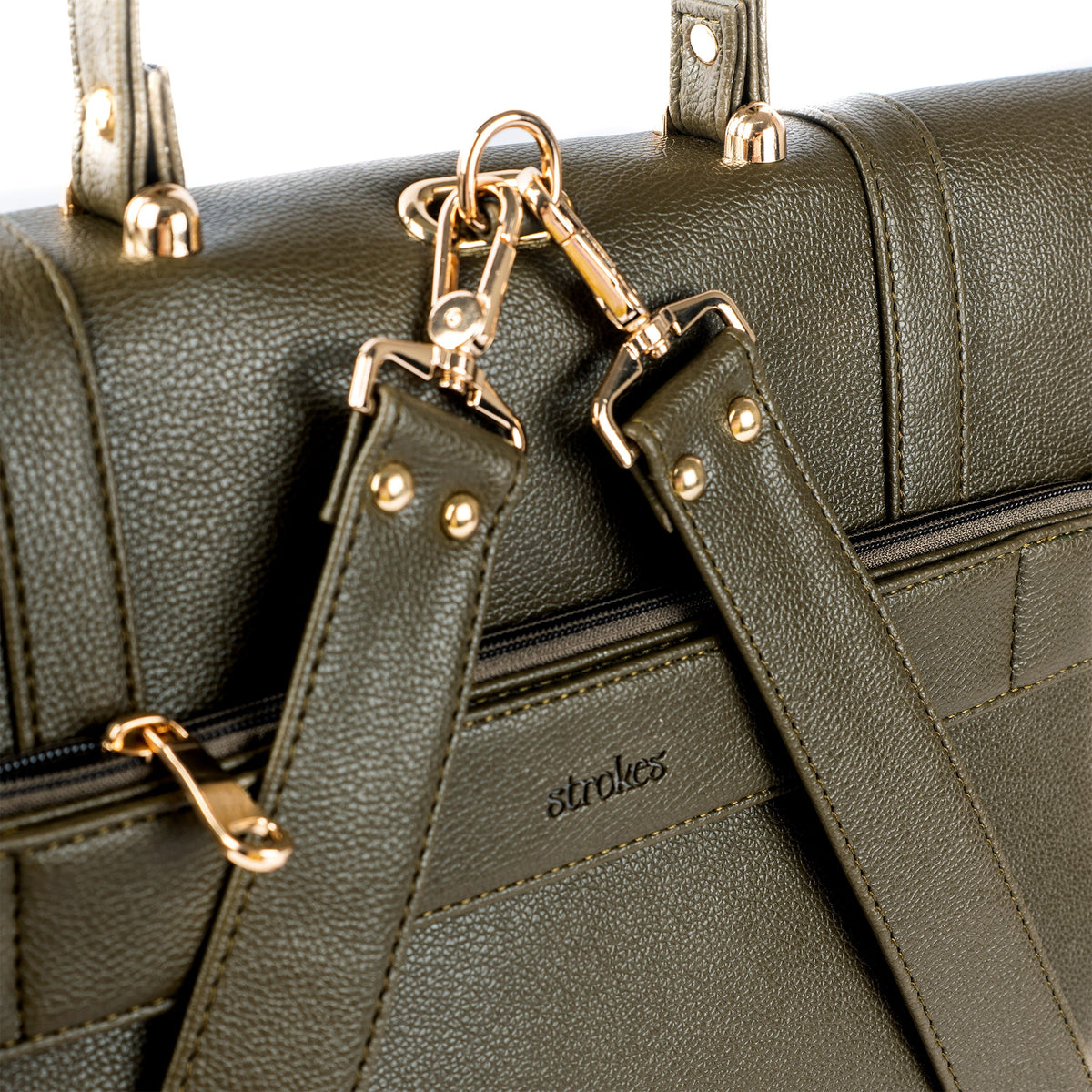 Olive convertible bag detail with gold-tone buckles, chain strap, and front flap